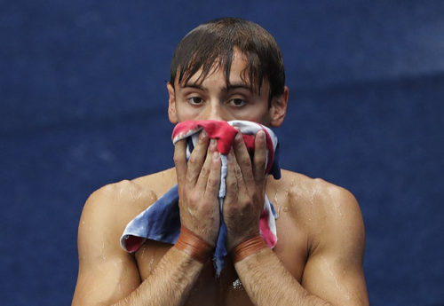 Britain's Tom Daley dries himself after the men's 10-meter platform diving semi-final in the Maria Lenk Aquatic Center at the 2016 Summer Olympics in Rio de Janeiro, Brazil, Saturday, Aug. 20, 2016.