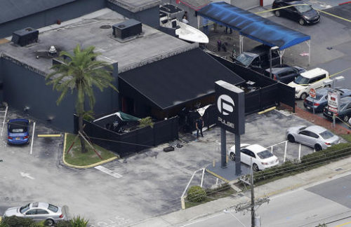 FILE - In this June 12, 2016 file photo, law enforcement officials work at the Pulse gay nightclub in Orlando, Fla., following the a mass shooting. Audio recordings of 911 calls released Tuesday, Aug. 30, by the Orange County Sheriff's Office show mounting frustration by friends and family members who were texting, calling and video-chatting with trapped patrons of the Pulse nightclub where Omar Mateen opened fire in June.
