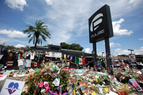 This Monday, July 11, 2016 photo shows a makeshift memorial outside the Pulse nightclub, a month after the mass shooting in Orlando, Fla. The more than 430 fundraisers posted on the GoFundMe website after the attack have exposed weaknesses inherent in these popular do-it-yourself charity campaigns: waste, questionable intentions and little oversight.