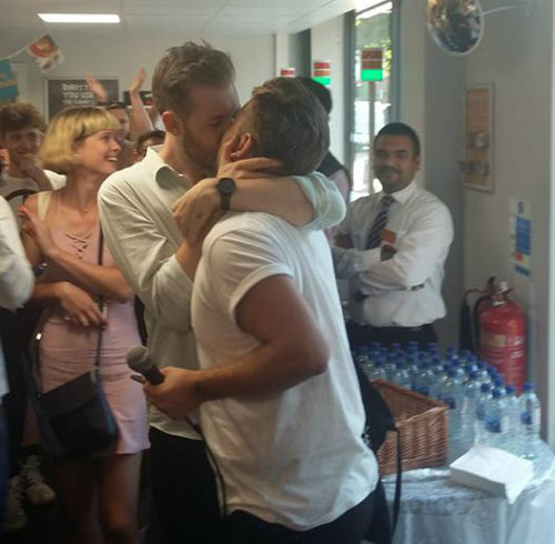 Nearly 200 protestors staged a kiss-in at a London store on Saturday.