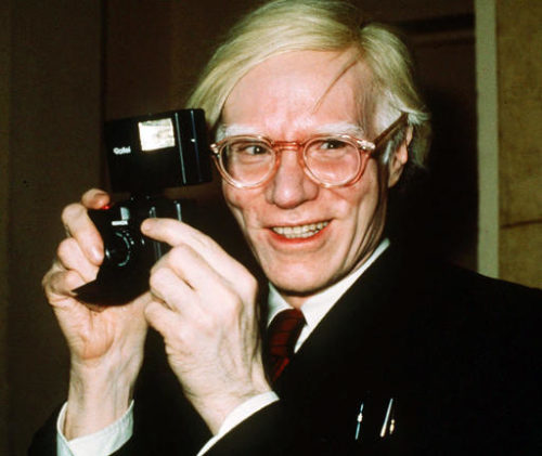 FILE - In this 1976 file photo, pop artist Andy Warhol smiles in New York. A representative Jared Leto confirmed on Sept. 20, 2016, that Leto will star as Warhol in an upcoming biopic.
