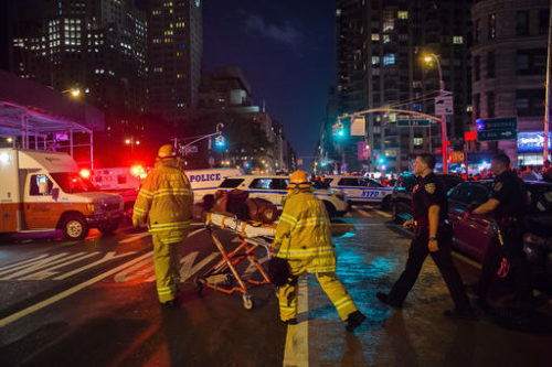 Police and firefighters work near the scene of an apparent explosion in Manhattan's Chelsea neighborhood, in New York, Saturday, Sept. 17, 2016. A law enforcement official tells The Associated Press that an explosion in the Chelsea neighborhood appears to have come from a construction toolbox in front of a building. The official spoke on condition of anonymity because the person wasn't authorized to speak about an ongoing investigation. More than two dozen people have sustained minor injuries in the explosion on West 23rd Street.