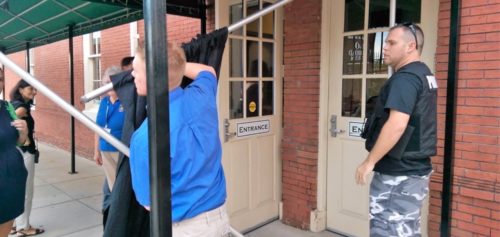 “Charm Ball” security erects a curtain to block the protesting Chase Brexton patients from the view of the gala guests.