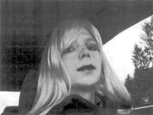 FILE - In this undated file photo provided by the U.S. Army Pfc. Chelsea Manning poses for a photo wearing a wig and lipstick. Manning, a transgender soldier imprisoned in Kansas for leaking classified information to the WikiLeaks website will end a hunger strike after the Army agreed to allow her to receive medical treatment for her gender dysphoria, the American Civil Liberties Union announced Tuesday, Sept. 13, 2016.