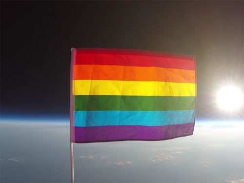 The LGBTQ Pride Flag miles above the earth.