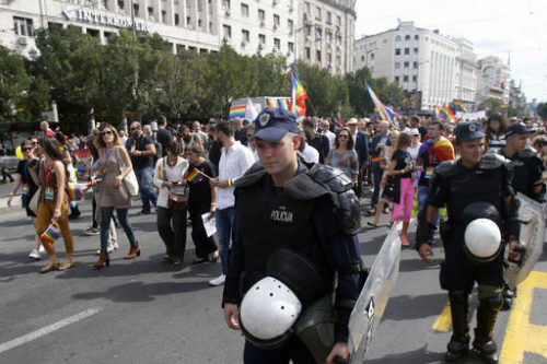 Serbian riot police guard Serbia's gay pride march in Belgrade, Serbia, Sunday, Sept. 18, 2016. Thousands of Serbian riot police have cordoned off central Belgrade for a gay pride march amid fears attacks from extremists in the predominantly conservative Balkan country seeking European Union membership.