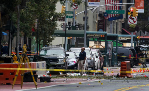 Crime scene investigators work at the scene of Saturday's explosion in Manhattan's Chelsea neighborhood, in New York, Sunday, Sept. 18, 2016.
