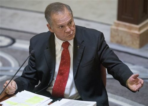 Alabama Chief Justice Roy Moore testifies during his ethics trial before the Alabama Court of the Judiciary at the Alabama Judicial Building in Montgomery, Ala., on Wednesday Sept. 28, 2016. He is accused of encouraging judges to defy the U.S. Supreme Court's ruling legalizing gay marriage.