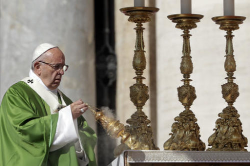 Pope Francis asperses incense as he celebrates a Jubilee Mass for catechists, at the Vatican, Sunday, Sept. 25, 2016.