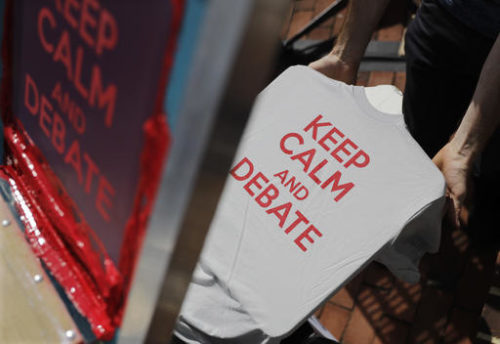 An artist prints t-shirts before the vice-presidential debate between Republican vice-presidential nominee Gov. Mike Pence and Democratic vice-presidential nominee Sen. Tim Kaine at Longwood University in Farmville, Va., Tuesday, Oct. 4, 2016.