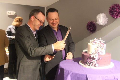 Bil Browning and Jerame Davis cut their wedding cake.