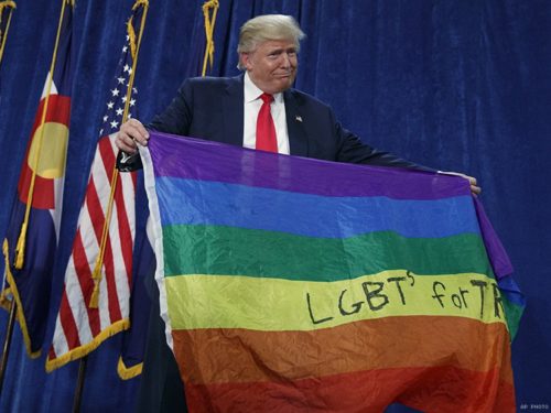 Donald Trump holds "LGBT for Trump" flag