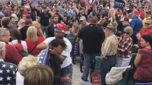 A Trump supporter in rainbow garb attacks a protester at a rally in Greensboro, NC. trump rally violence