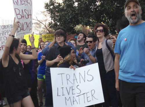 FILE- In this March 24, 2016, file photo, people protest outside the North Carolina Executive Mansion in Raleigh, N.C. Tennessee businesses have banded together to try to convince their state legislators to snub laws similar to the infamous bathroom bill in North Carolina, which has consumed that state's politics for months and scared off businesses and sporting events.