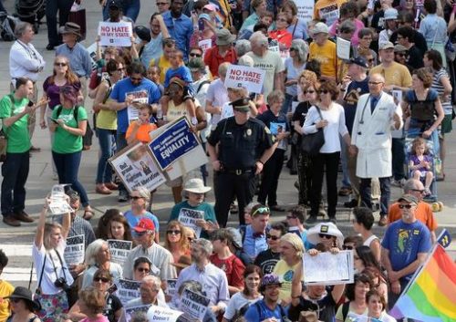 FILE - In this April 25, 2016 file photo, protesters head to the legislative building in Raleigh, N.C., for a sit-in against House Bill 2, a contentious law that limited protections for LGBT people. After a string of major gains in recent years, LGBT activists are bracing for a different task in 2017 - trying to prevent Republicans in Congress and state legislatures from undermining those gains.