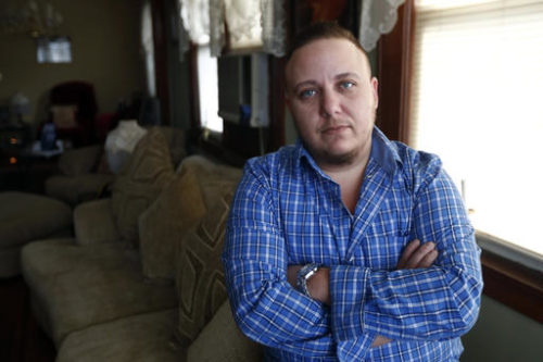 Jionni Conforti poses for The Associated Press in his home, Thursday, Jan. 5, 2017, in Totowa, N.J. The transgender man has sued St. Joseph's Regional Medical Center in Paterson, N.J., after he said it cited religion in refusing to allow his surgeon to perform a hysterectomy procedure he said was medically necessary as part of his gender transition. Conforti had scheduled the surgery in 2015, but he alleges in the federal lawsuit that a hospital administrator then told him the procedure to remove the uterus he was born with couldn't be done because it was a "Catholic hospital."
