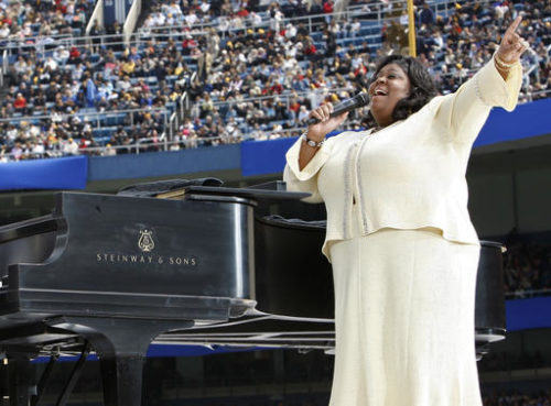 FILE - In this Sunday, April 20, 2008 file photo, Kim Burrell performs prior to a Mass by Pope Benedict XVI at Yankee Stadium in New York. Ahead of a performance on the talk show "Ellen" in early January 2017, gospel singer Burrell says she make "no excuses or apologies" for a sermon at a Houston church where she referred to gays and lesbians as perverted.