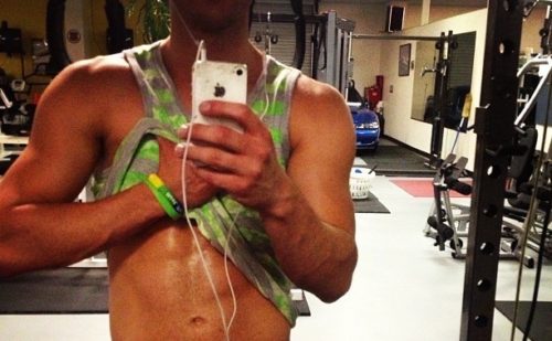 Personal trainer Philip Bondi shows off his abs.