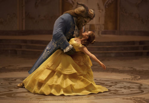 This image released by Disney shows Dan Stevens as The Beast, left, and Emma Watson as Belle in a live-action adaptation of the animated classic "Beauty and the Beast."