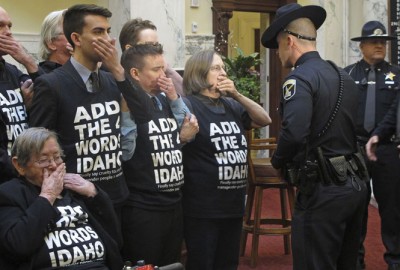 An Idaho State Police officer arrests a gay rights protester on the Idaho Senate floor, Monday, March 2, 2015, in Boise, Idaho. LGBTQ advocates have repeatedly tried and failed to add LGBTQ protections to Idaho state law.