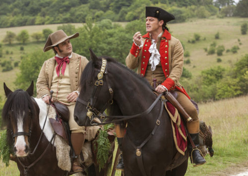 This image released by Disney shows Josh Gad as Le Fou, left, and Luke Evans as Gaston in a scene from, "Beauty and the Beast," opening nationwide on March 17.