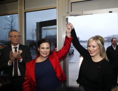 Newly elected MLA for Mid Ulster Sinn Fein's Michelle O'Neill, right, is congratulated by party member Mary Lou McDonald at the count centre in Belfast, Northern Ireland, Friday, March 3, 2017. Counting has begun across Northern Ireland with Irish Nationalists seeking to boost their vote in an early election that could shape the fate of the Catholic-Protestant cooperation in Northern Ireland.