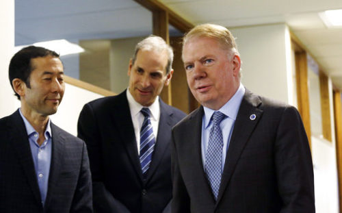 Seattle Mayor Ed Murray, right, walks past his husband, Michael Shiosaki, left, and his attorney, Bob Sulkin, before speaking to the media, Friday, April 7, 2017, in Seattle. Three men claim that Murray sexually abused them in the 1980s, paying for sex when they were teenagers and Murray was in his 30s. Murray denied the allegations and said he will not step down.