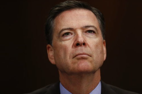 FILE- In this May 3, 2017, file photo, FBI Director James Comey listens on Capitol Hill in Washington. President Donald Trump has fired Comey. In a statement on Tuesday, May 9, Trump says Comey’s firing “will mark a new beginning” for the FBI.
