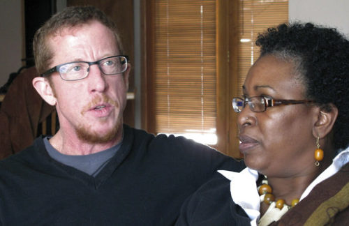 FILE - In this March 30, 2012, file photo, Drew Phoenix, left, and his girlfriend, Ellen Robertson, talk about a ballot initiative going before local voters that calls for equal legal protections for gay and transgender residents, in Anchorage, Alaska. The Alaska Legislature on Tuesday, May 16, 2017, rejected the appointment of Phoenix, a transgender man, to serve on the state's human rights commission. In a phone interview Tuesday evening, Phoenix said he was "incredibly upset and disheartened" by the vote.