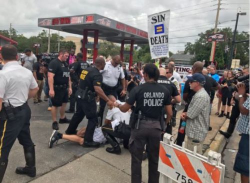 An antigay street preacher is taken to the ground by police at the Pulse nightclub on the one year anniversary of the shooting that claimed the lives of 49 people. antigay preacher arrested pulse