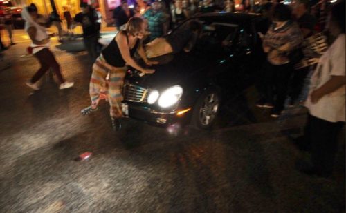 A car strikes demonstrators in St. Louis.