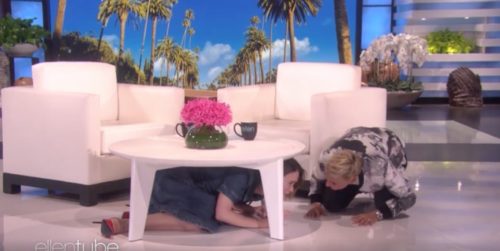 Sarah Paulson is left quivering under the table after being scared by Ellen DeGeneres.