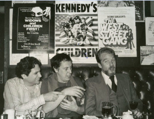 Gay playwrights Harvey Fierstein, Robert Patrick, and Doric Wilson under their posters in Phebes Bar, NYC, in 1980.