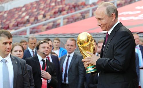 Russian president Vladimir Putin holding the FIFA World Cup trophy at a pre-tournament ceremony in Moscow, September 2017.