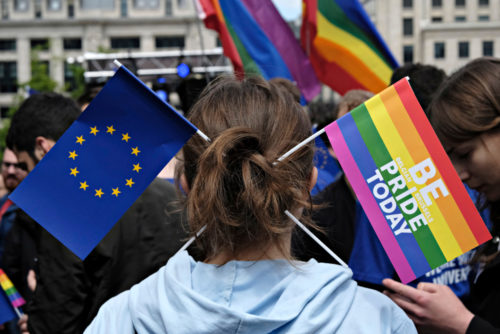 A young man sports rainbow and European Union flags in his hair during the Belgian Gay Pride parade in Brussels Belgium on May 20, 2017. Participant has Rainbow and European flag in his hair during the Belgian Gay Pride parade in Brussels Belgium on May 20, 2017