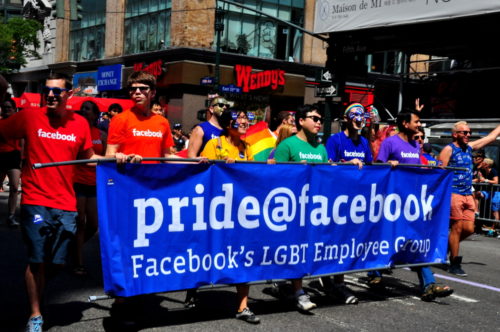 Pride Facebook group with their blue banner at the 2014 LGBT Pride Parade on Fifth Avenue in NYC. Pride Facebook group with their blue banner at the 2014 LGBT Pride Parade on Fifth Avenue in NYC.
