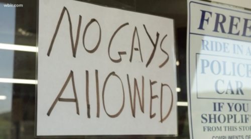 The sign Jeff Amyx posted in the window of his hardware store is being widely criticized for the sheer bigotry. Sign on a store window reading "NO GAYS ALLOWED"