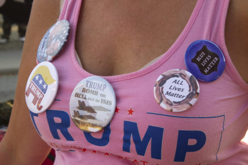 September 12, 2016: Close up of a woman wearing a bright pink Donald Trump T-Shirt covered with Trump campaign buttons on September 12, 2016 in Asheville, NC September 12, 2016: Close up of a woman wearing a bright pink Donald Trump T-Shirt covered with Trump campaign buttons on September 12, 2016 in Asheville, NC