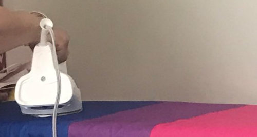 Close up on Lexie's Grandma ironing the bi pride flag Close up on Lexie's Grandma ironing the bi pride flag