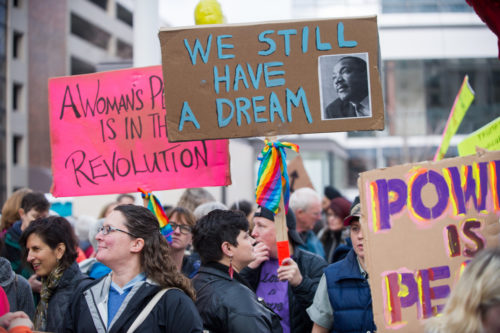 December 3, 2016: Portland Women March Against Hate, downtown Portland, Oregon. December 3, 2016: A participant in the Portland Women March Against Hate carry signs reading "We still have a dream"