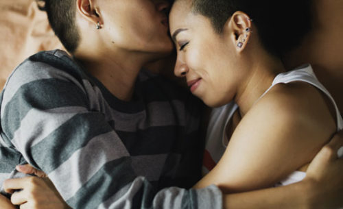 A lesbian couple share a romantic moment together. A lesbian couple share a romantic moment together.