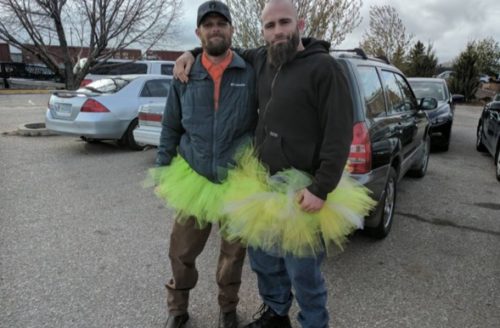 Two men wear tutus to stand up for equality and diversity in Wyoming. Two men wearing bright tutus overtop of regular clothes