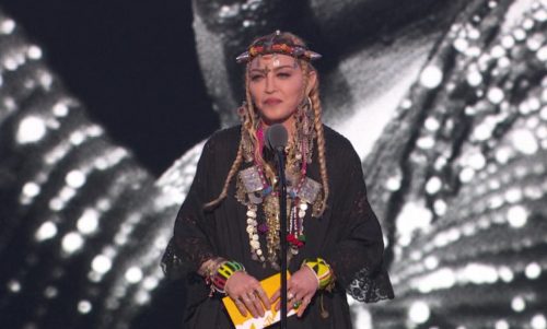 Standing in front of a giant image of Aretha Franklin, Madonna gave a speech about... her own journey to stardom. madonna-aretha