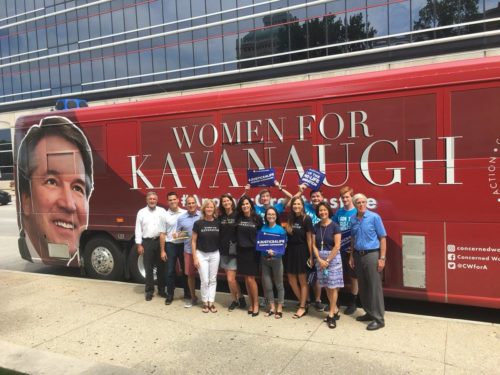 Over half of the "concerned women for America" supporting Supreme Court nominee Brett Kavanaugh are actually... men. Photo of six women and seven men standing in front of a "Women for Kavanaugh" sign