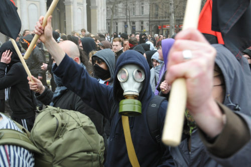 A breakaway group of anarchist protesters march through the streets of the British capital during a large anti-cuts rally on March 26, 2011 in London, UK. A breakaway group of anarchist protesters march through the streets of the British capital during a large anti-cuts rally on March 26, 2011 in London, UK.