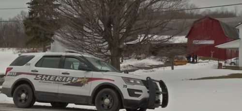 A Wyoming County sheriff's vehicle sits outside Joseph Mlyniec's rural New York farm. A Wyoming County sheriff's vehicle sits outside Joseph Mlyniec's rural New York farm.