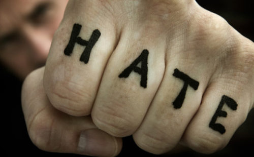 Fist that says "HATE" on it.