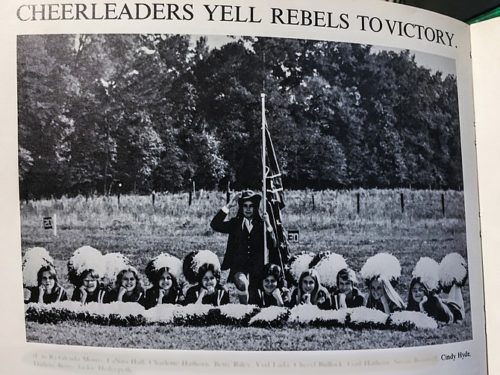 A picture in the Lawrence County Academy Yearbook shows future Senator Cindy Hyde-Smith posing below a Confederate flag.