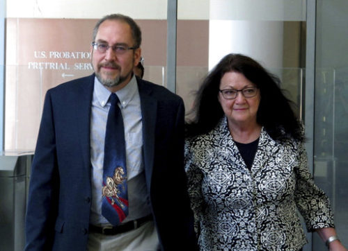 FILE - In this Sept. 22, 2016 file photo, Virginia businessman Philip Zodhiates leaves U.S. District Court in Buffalo, N.Y., where he was on trial for international parental kidnapping and conspiracy. Zodhiates was convicted of the charges on Sept. 29, 2016, after prosecutors say he helped a mother move her daughter out of the country and away from her ex-partner. Vermont U.S. District Court Judge William Sessions on Monday, March 20, 2017, ruled that a lawsuit filed by Janet Jenkins, whose former civil union partner fled the country with their child rather than share custody, is being allowed to proceed because Zodhiates is set to be sentenced in a separate criminal case. (AP Photo/Carolyn Thompson, File) Philip Zodhiates and a woman leaving a building