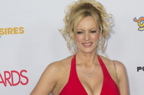 Adult film actress Stormy Daniels, attends the 2016 Adult Video News Awards at the Hard Rock Hotel & Casino on January 23, 2016 in Las Vegas, Nevada. Stormy Daniels in a red dress.